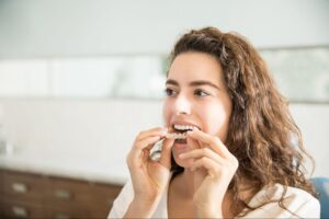 Adult patient wearing clear aligners near Phoenix, AZ