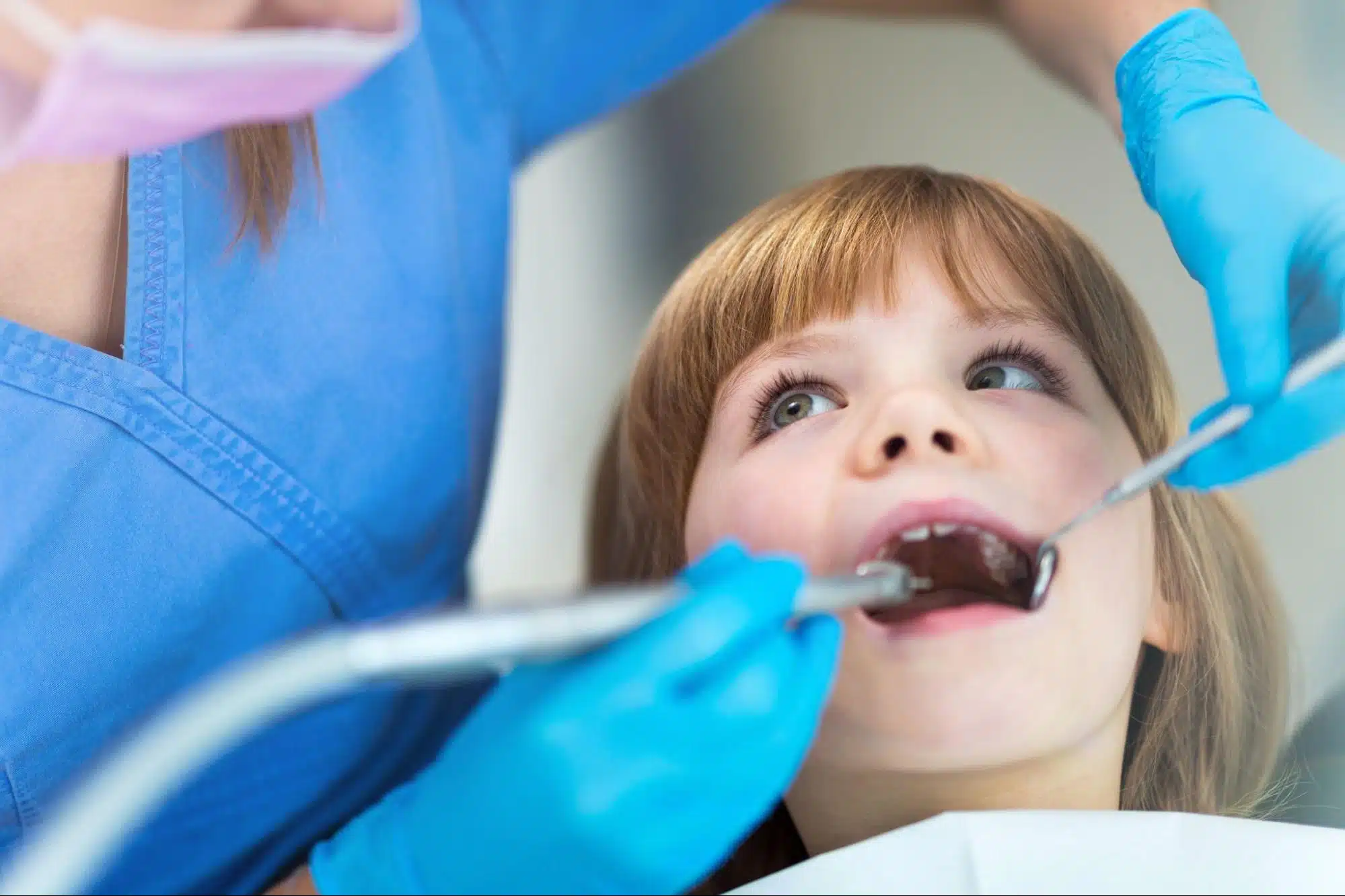 Child during an early orthodontic evaluation at an orthodontic office