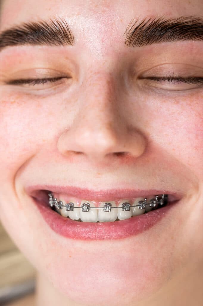Adult patient reviewing traditional braces options near Phoenix, AZ